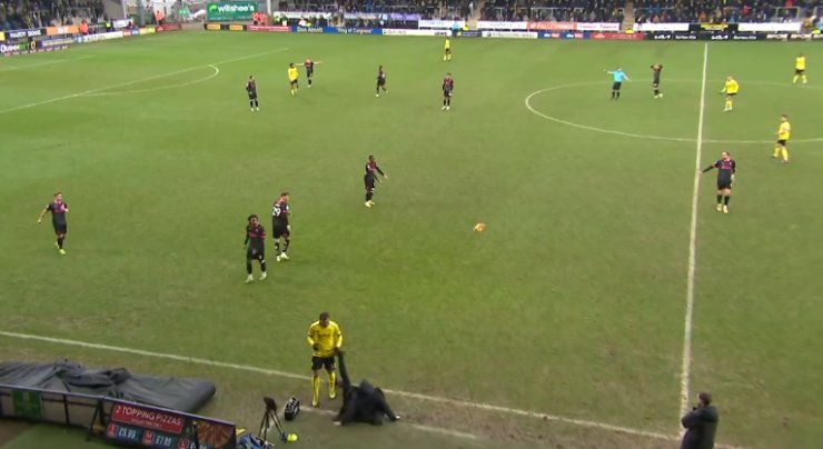 Burton's manager knocked the ball away after it slipped on the touchline.